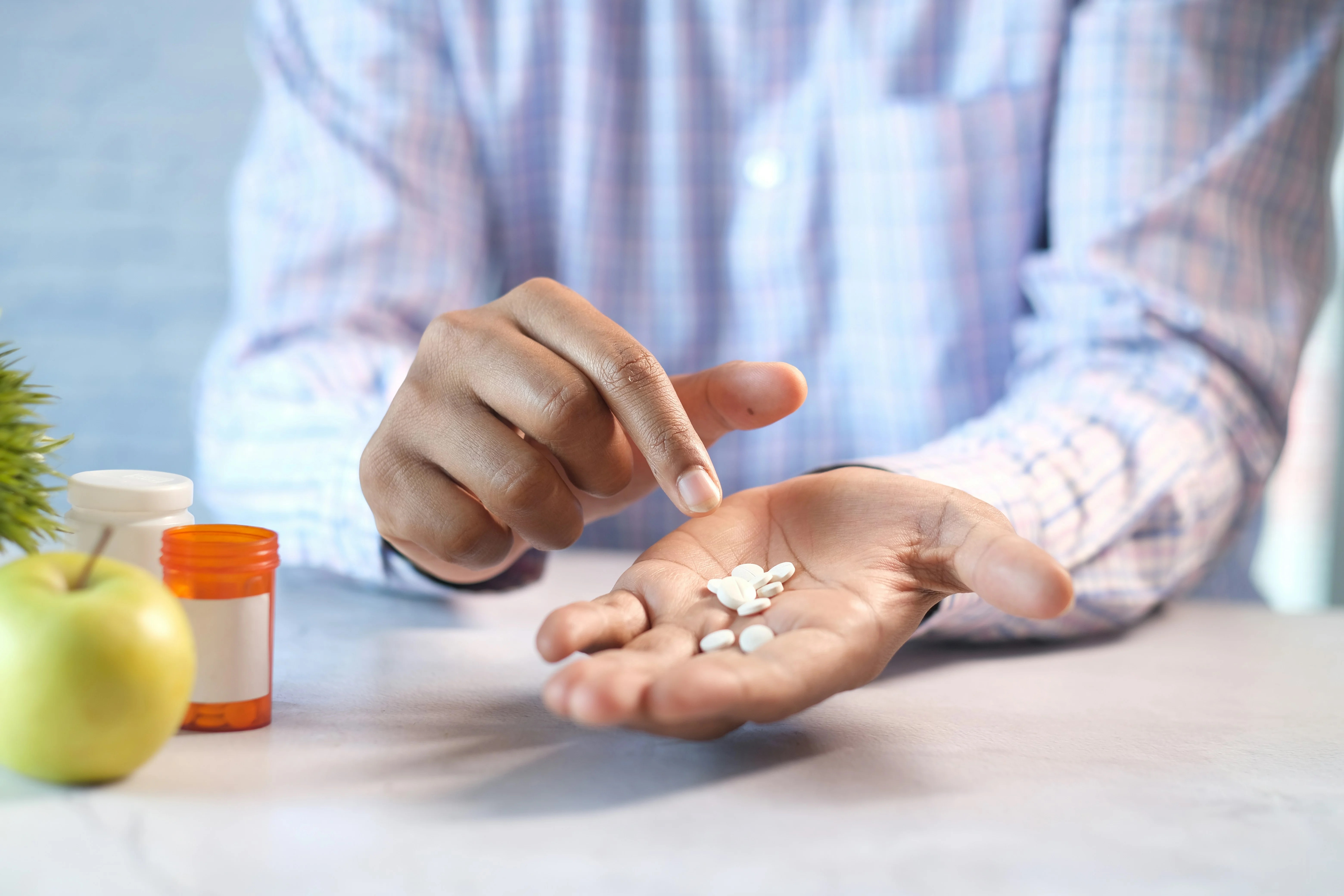 Photo Of Person Holding Pills Showing What Can The ER Do For Tooth Pain