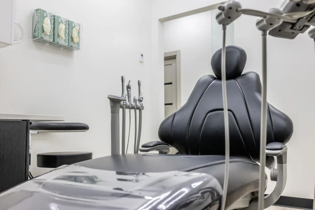 Modern Dental Office With Black Patient Chair Dental Tools And White Walls Prepared For Treatment